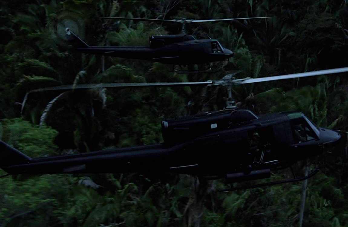 Vietnam War era choppers flying over the jungle in Predator