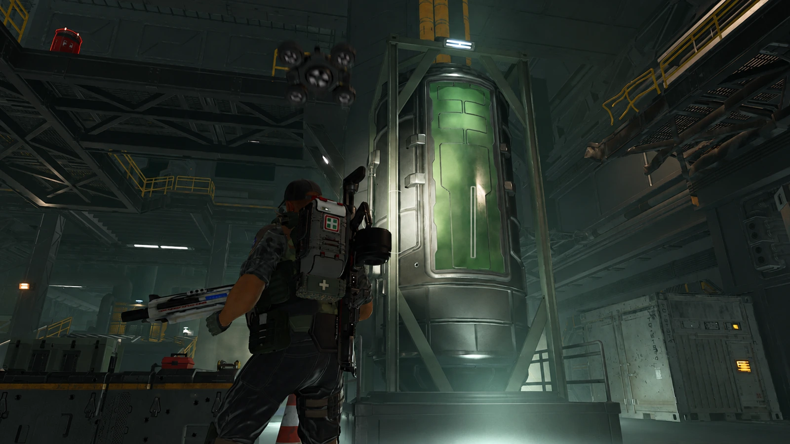 A Colonial Marine standing in front of a sealed Acidium tank at Storr's Boon in Aliens Fireteam Elite 2