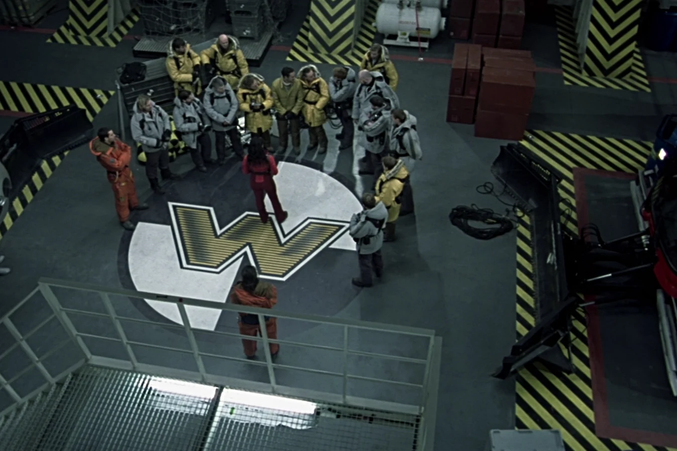 Alexa Woods briefs Weyland's team on the Piper Maru helipad