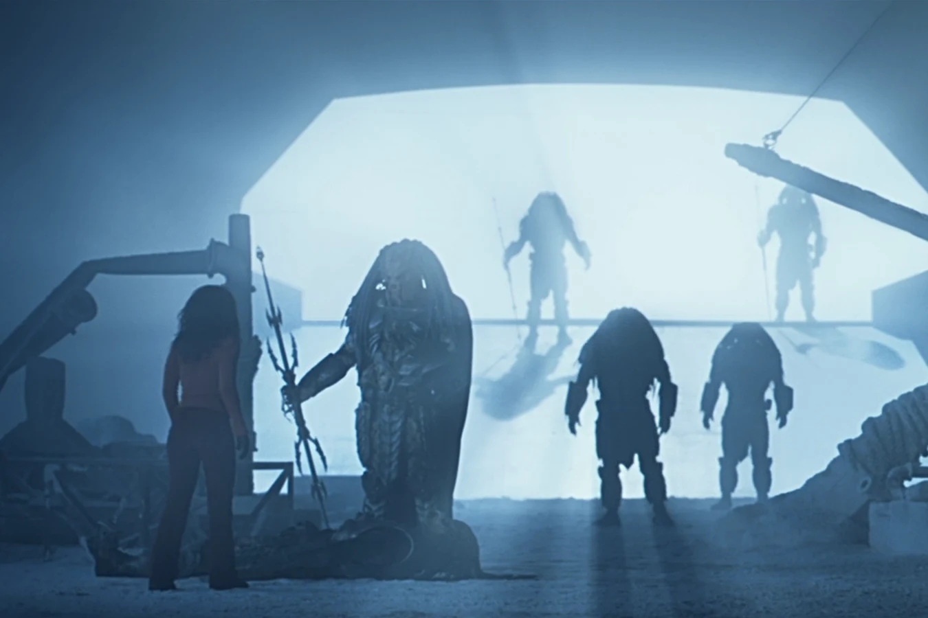 The Antarctica Elder gives Alexa Woods a spear on the ice after the hunt