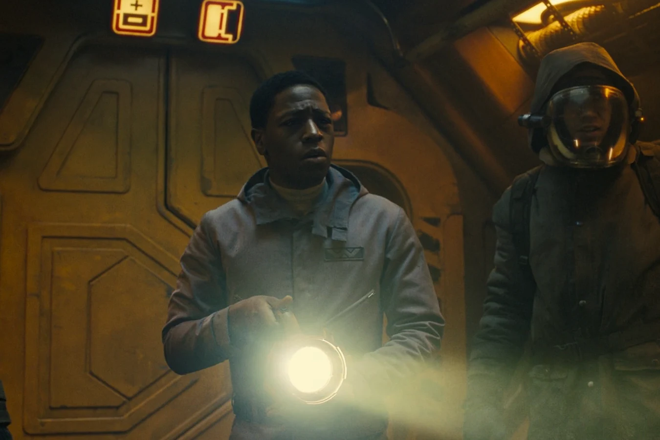 Andy with a flashlight between Tyler and Bjorn in pressure helmets