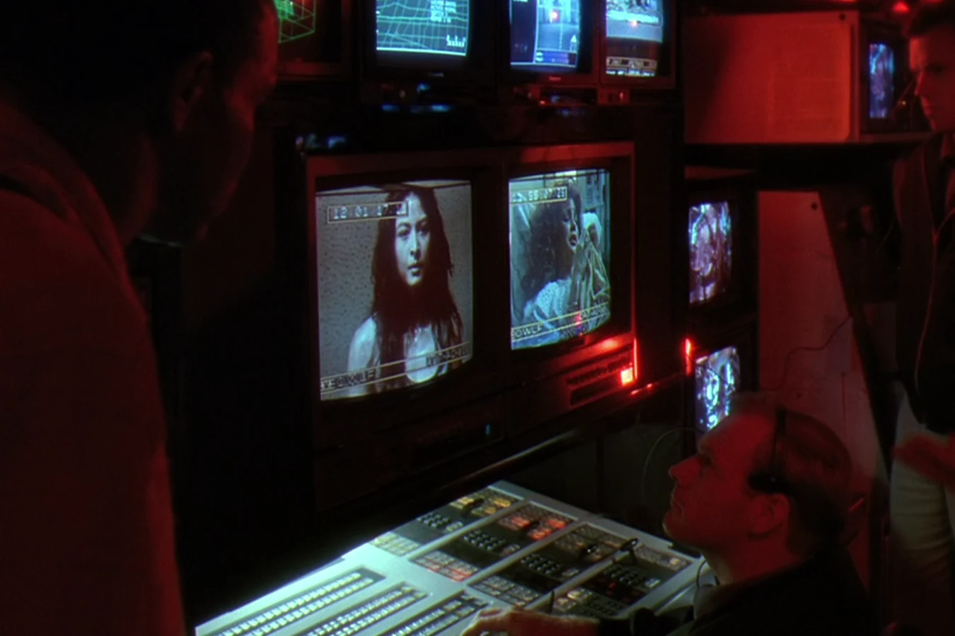 Anna Gonsalves on a video monitor in Peter Keyes' OWLF command trailer in Predator 2