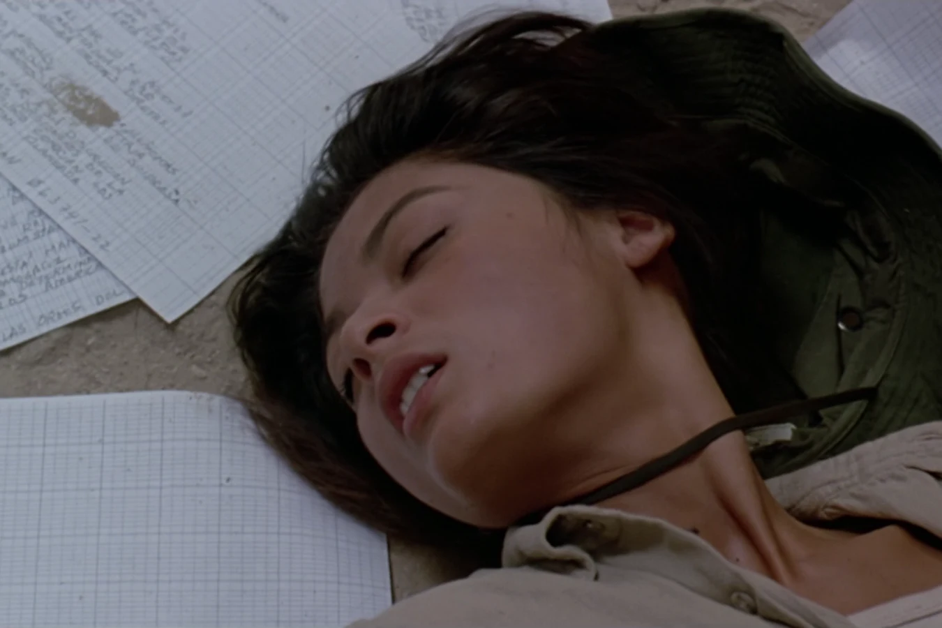 Anna Gonsalves lying unconscious on the floor of the guerrilla hut among scattered papers