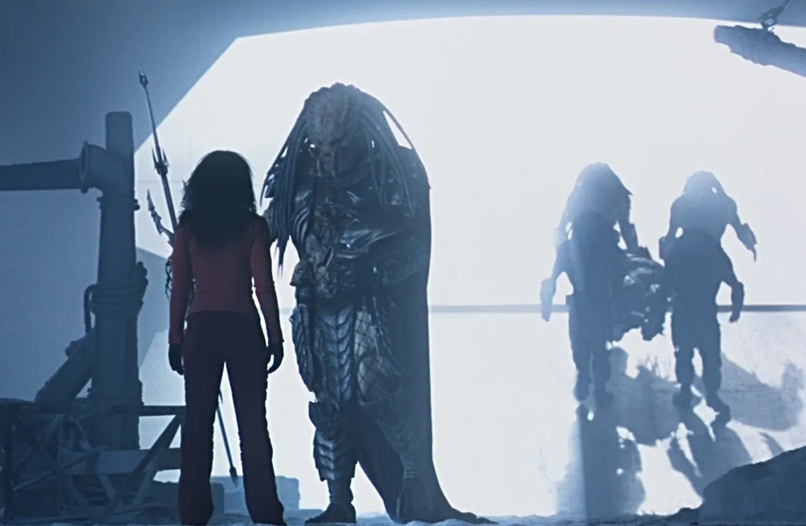 Scar Predator's body being taken aboard the Predator ship