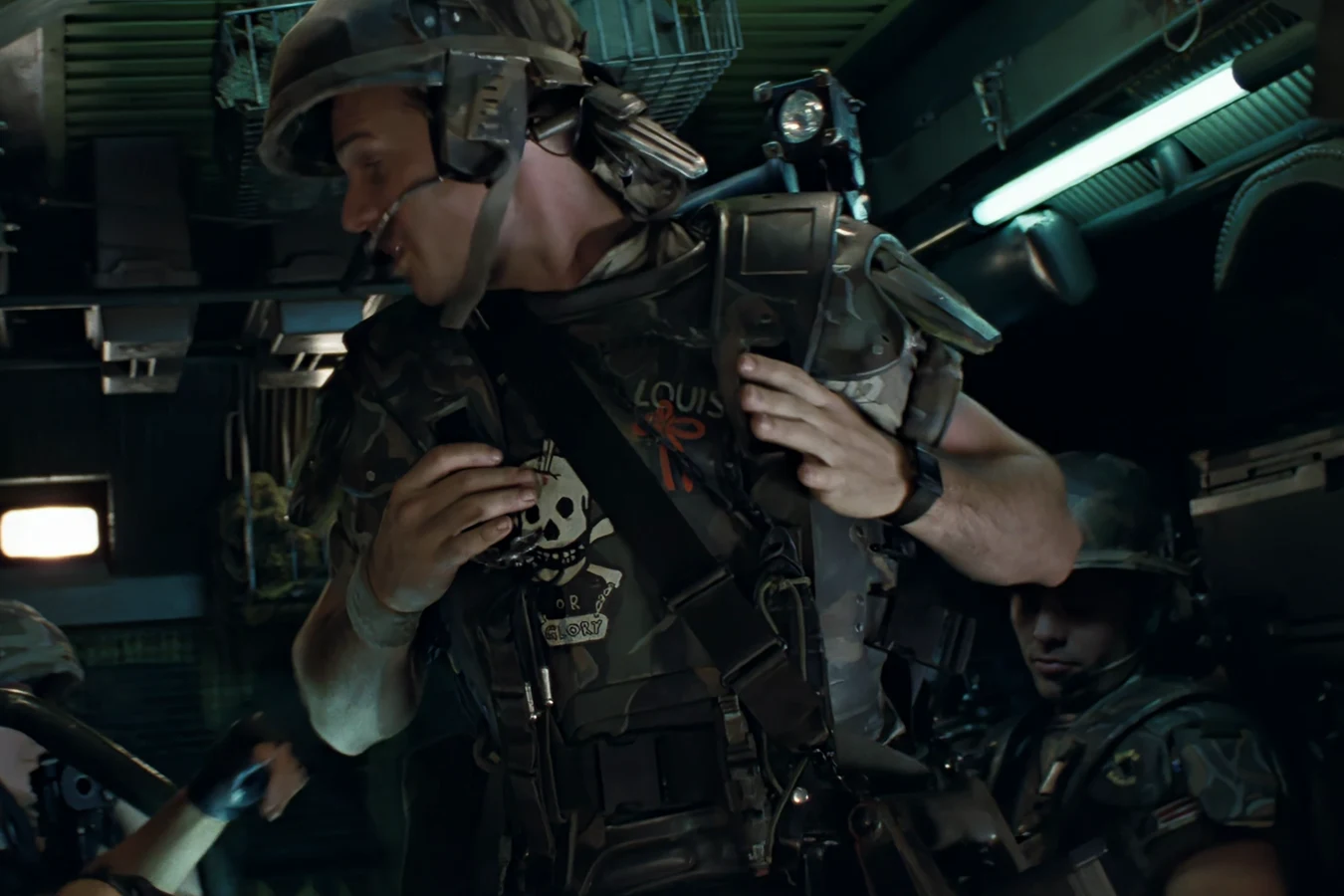 Hudson buckling M3 armor and an M10 helmet inside the APC in Aliens