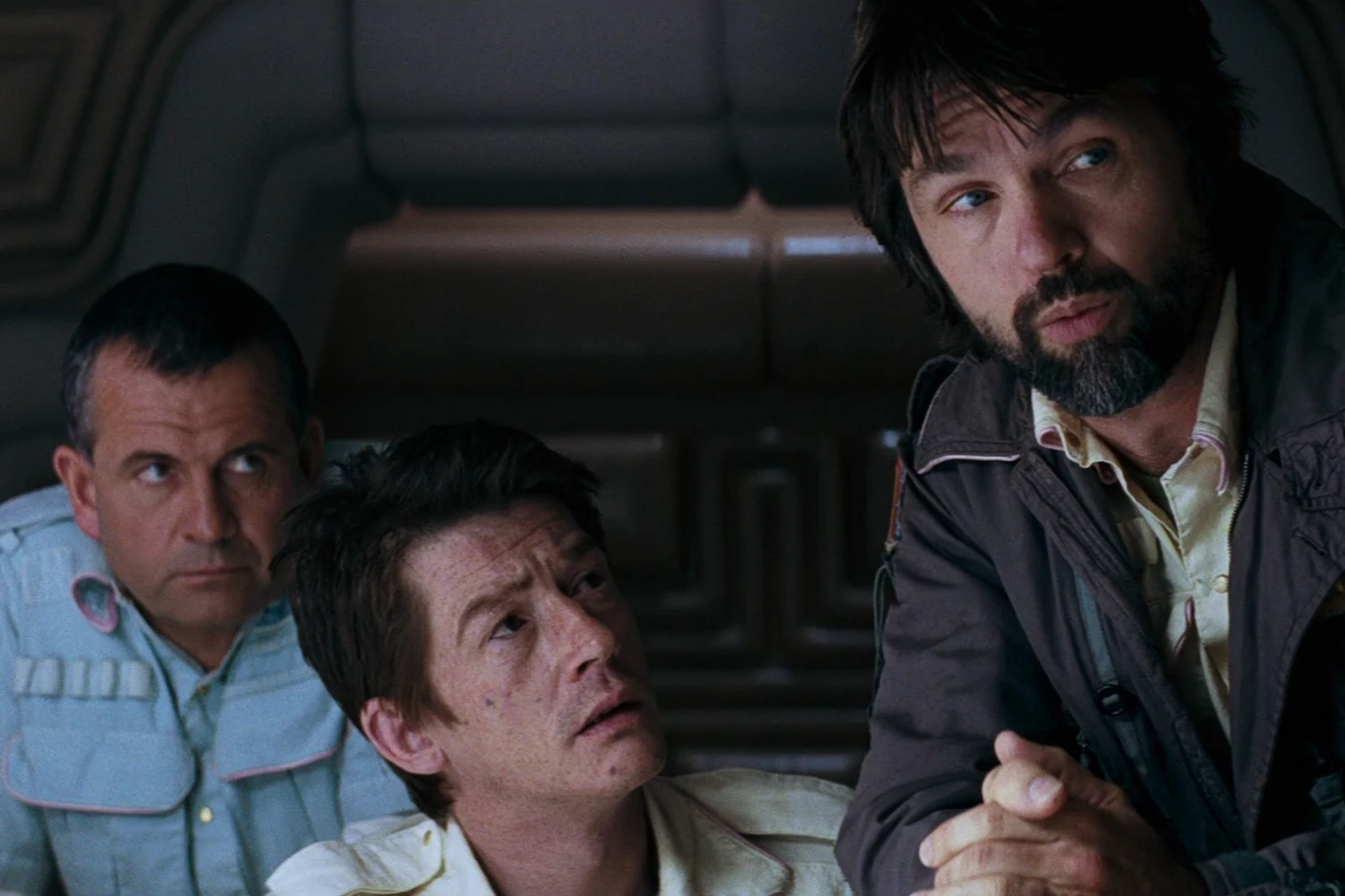 Ash, Kane, and Dallas at the Nostromo mess table after the crew woke