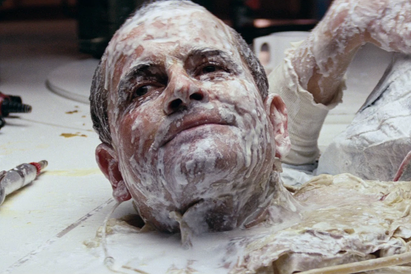 Ash's severed head on the Nostromo mess table during his final speech