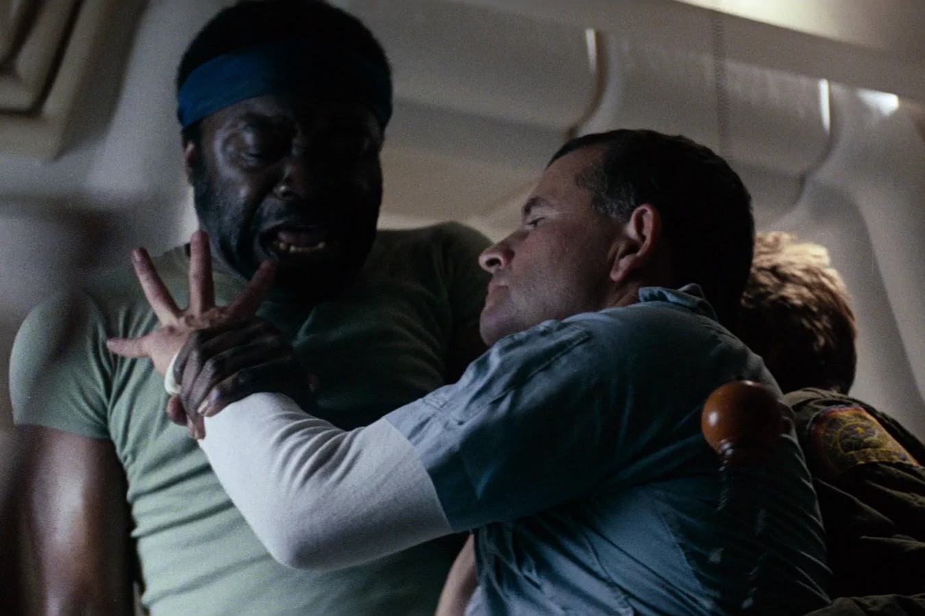 Parker choking Ash after the synthetic attacked Ripley