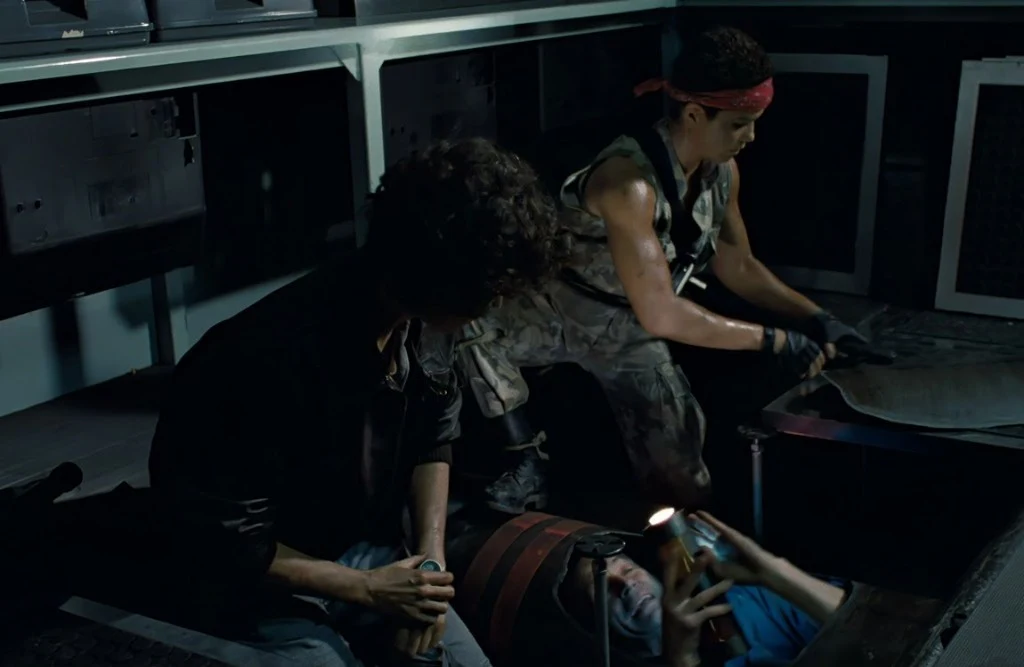 Ripley and Vasquez watching Bishop drop into the medlab conduit in Aliens