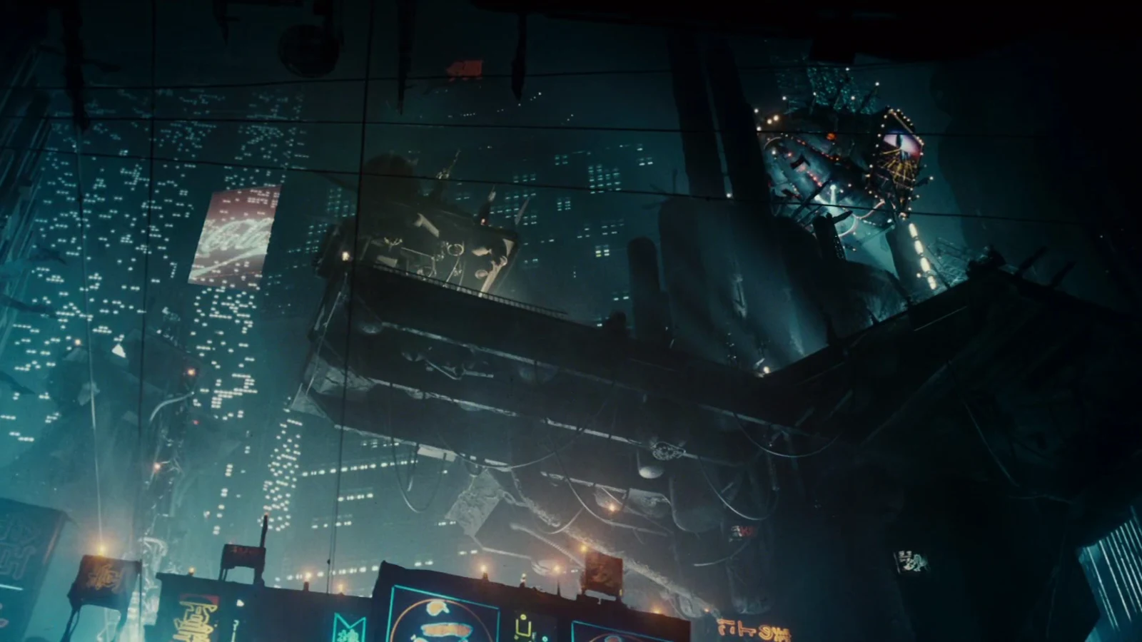 Rain-dark Los Angeles towers, neon signs, and a hanging megastructure in Blade Runner
