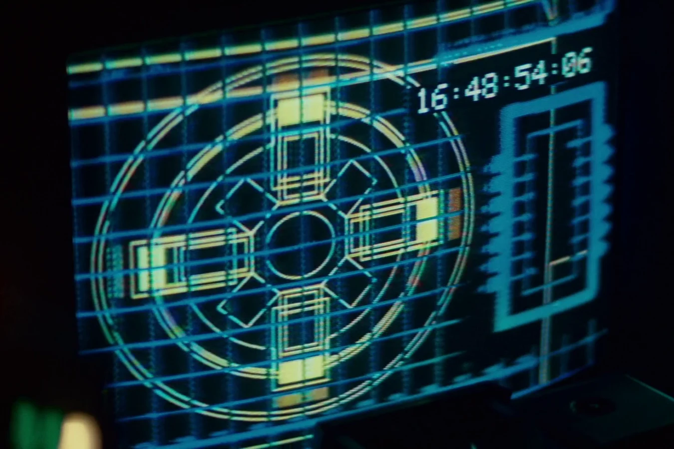 A glowing blue and yellow cockpit monitor graphic with a time readout in Blade Runner