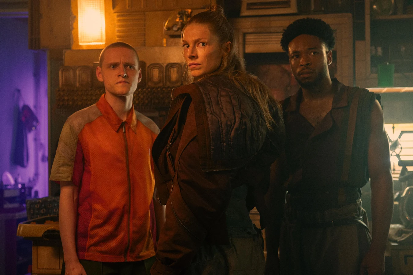 Hunter Schafer as Cora in a workshop with two series regulars in Blade Runner 2099