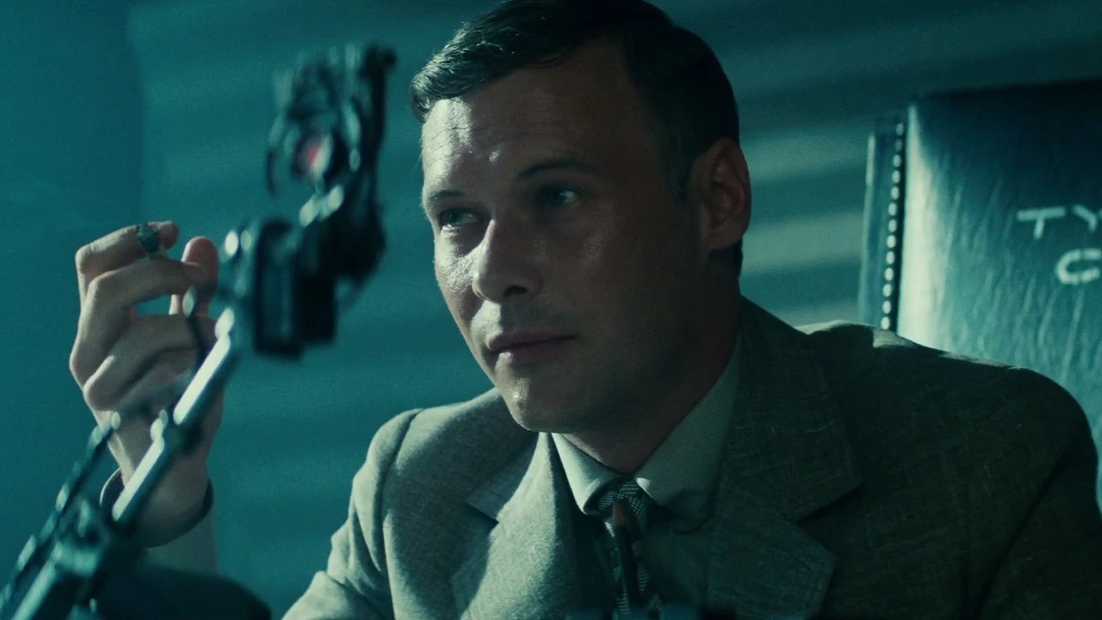 Morgan Paull as Dave Holden holding a cigarette beside the Voight-Kampff machine in Blade Runner