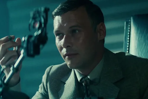 Morgan Paull as Dave Holden holding a cigarette beside the Voight-Kampff machine in Blade Runner