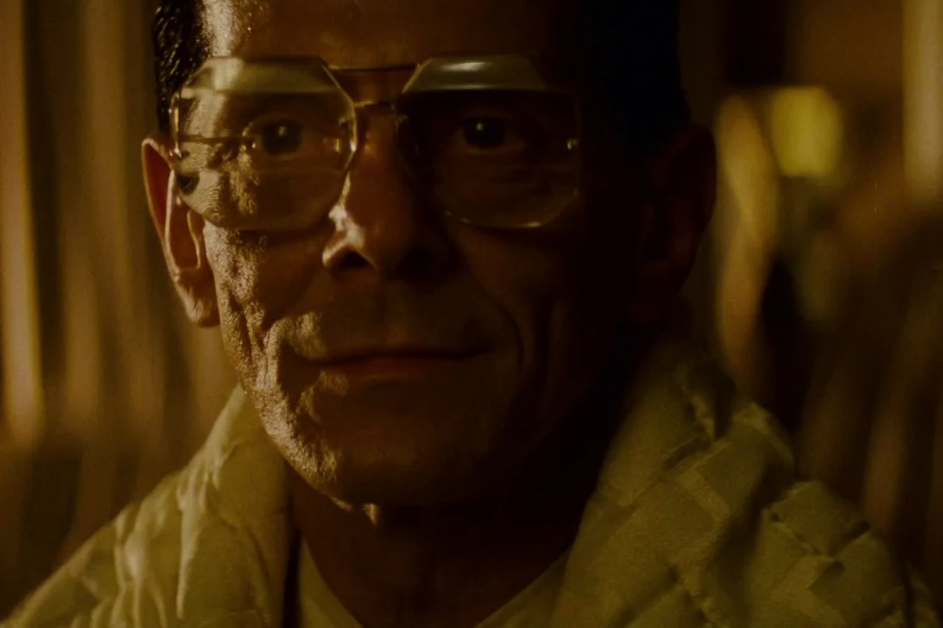 Joe Turkel as Eldon Tyrell smiling warmly at Roy Batty in his candlelit bedroom in Blade Runner