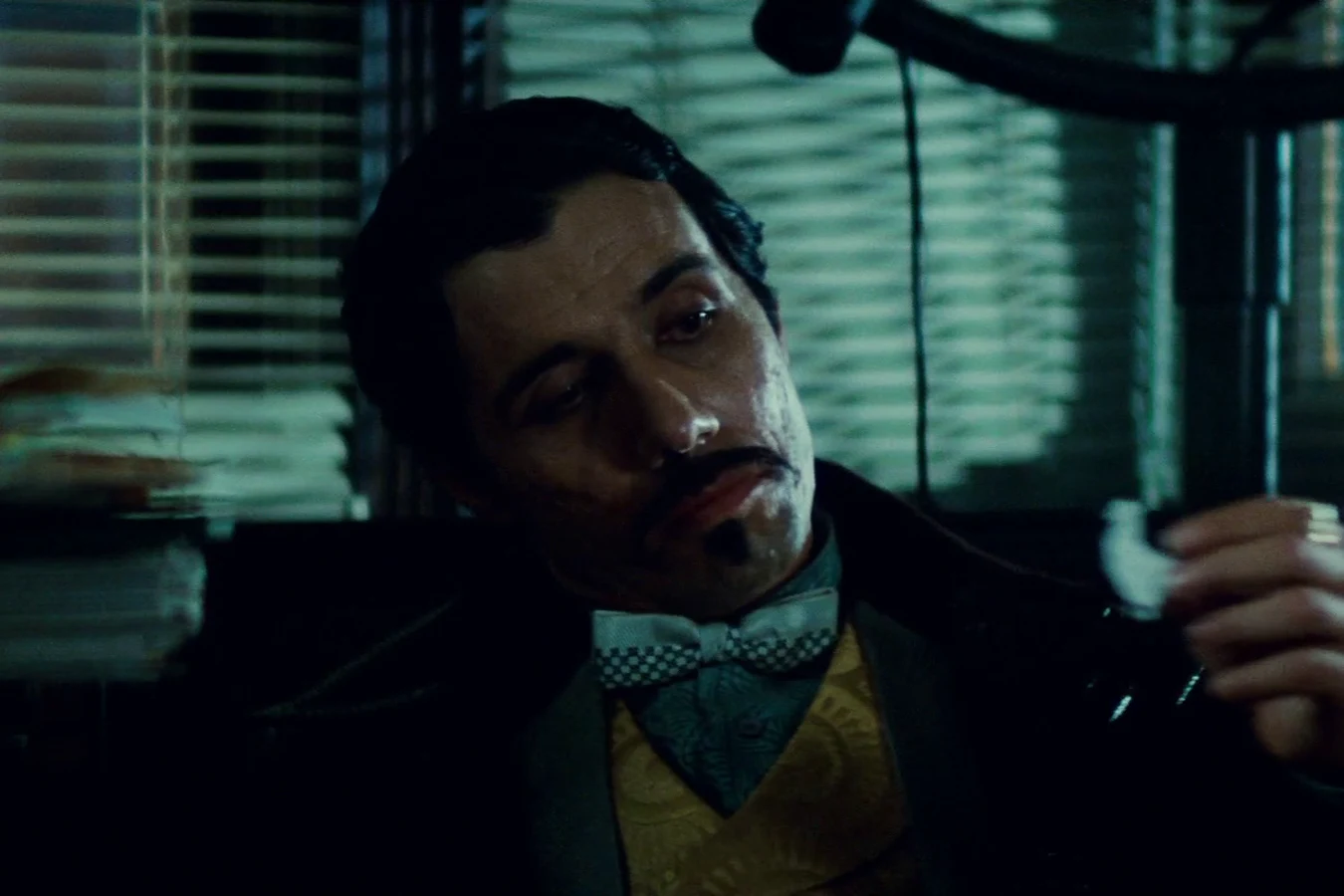 Edward James Olmos as Gaff folding a matchstick origami chicken in Blade Runner