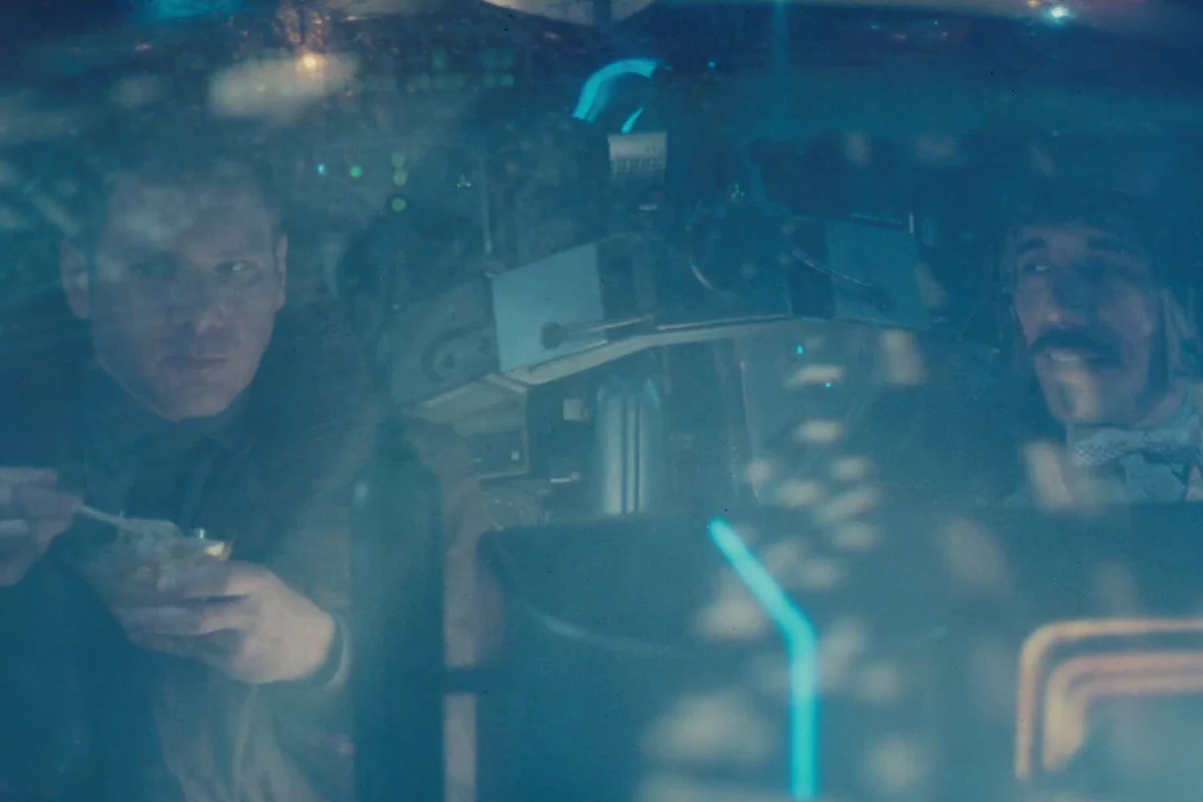 Gaff flying a police spinner with Rick Deckard toward LAPD headquarters in Blade Runner