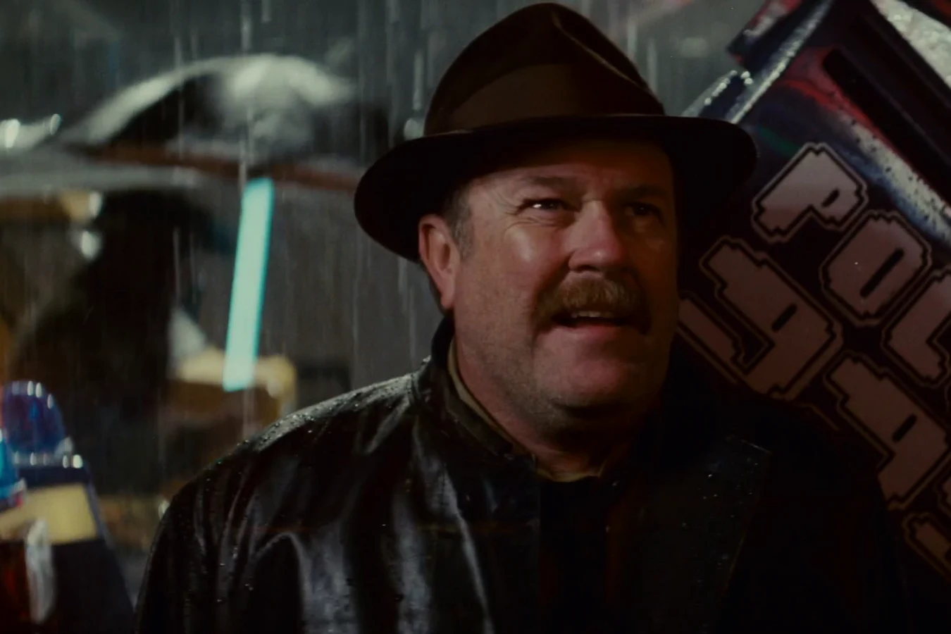 Captain Harry Bryant speaking to Deckard in the rain after Zhora's retirement in Blade Runner