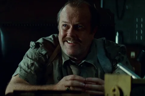 M. Emmet Walsh as Captain Harry Bryant in a suit and fedora in Blade Runner