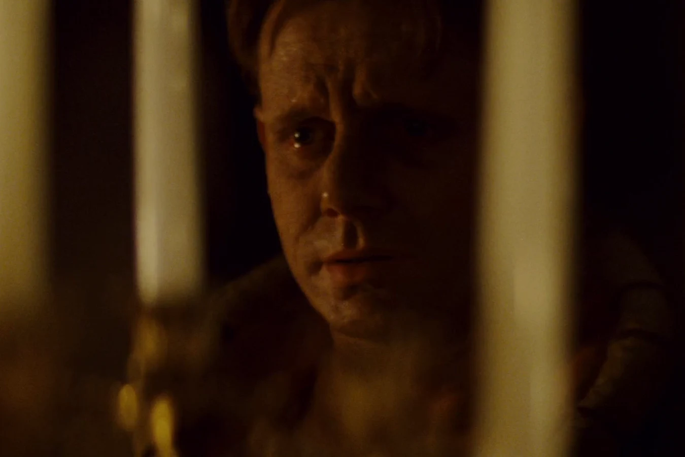 J.F. Sebastian watching in horror through the candles in Tyrell's bedroom in Blade Runner