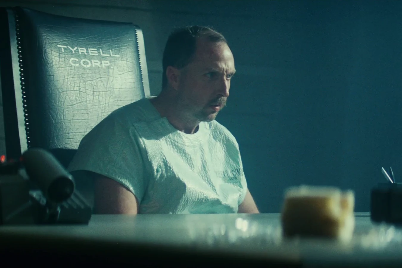 Brion James as Leon Kowalski seated for the Voight-Kampff test at the Tyrell Corporation in Blade Runner