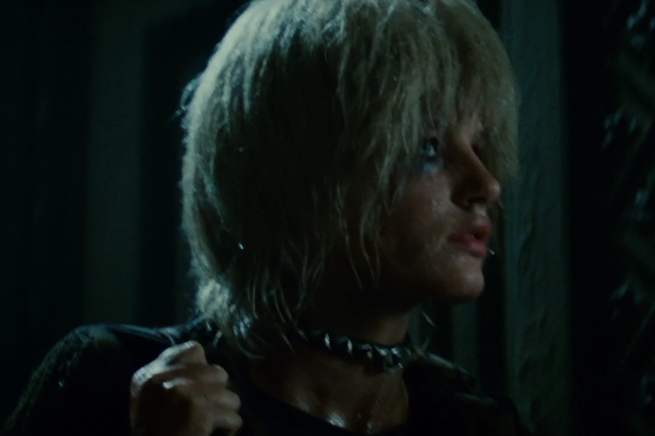 Pris walking through the dark hallway of the Bradbury Building in Blade Runner