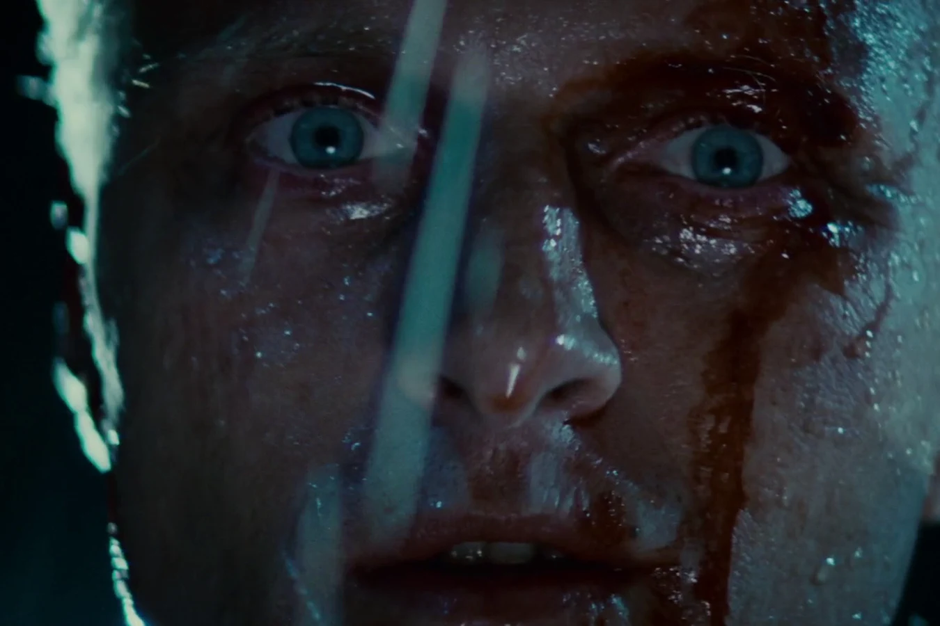 Rutger Hauer as Roy Batty in bloodied close-up in the rain on the rooftop in Blade Runner