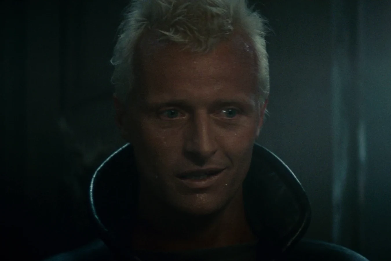 Rutger Hauer as Roy Batty smiling in J.F. Sebastian's apartment in the Bradbury Building in Blade Runner