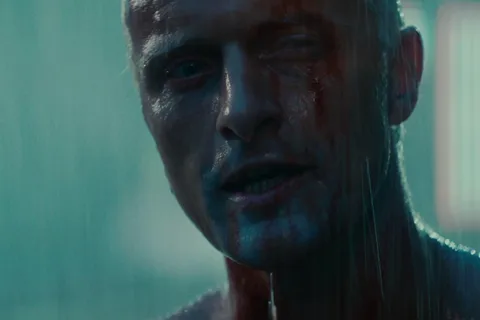 Rutger Hauer as Roy Batty, shirtless and bloodied in the rain on the rooftop in Blade Runner