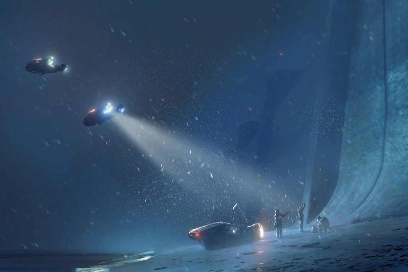 Spinners shining searchlights on figures at the foot of a towering sea wall in the snow