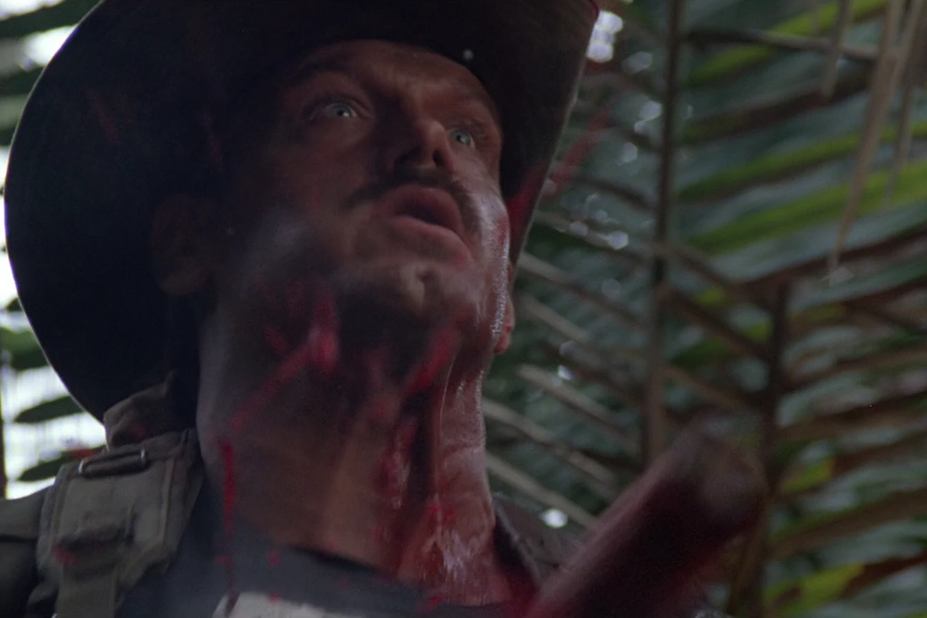 Blain Cooper struck in the chest by the plasma caster bolt in Predator