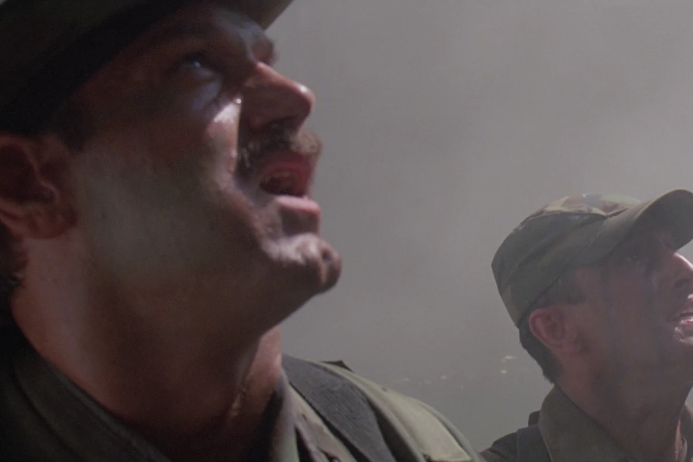 Blain Cooper looking up through the smoke of the burning guerrilla camp in Predator