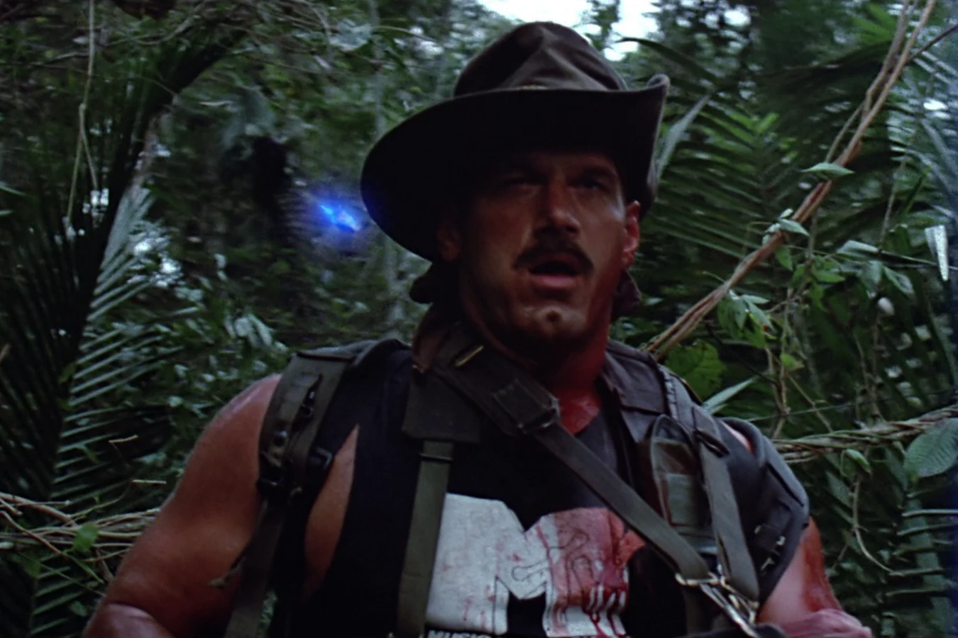 The Jungle Hunter's triangular laser sight settling on Blain Cooper in Predator