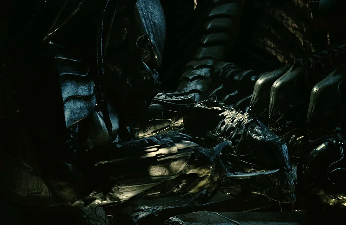 Bonegrill using a flaying tool on a Xenomorph head aboard the Scout Ship