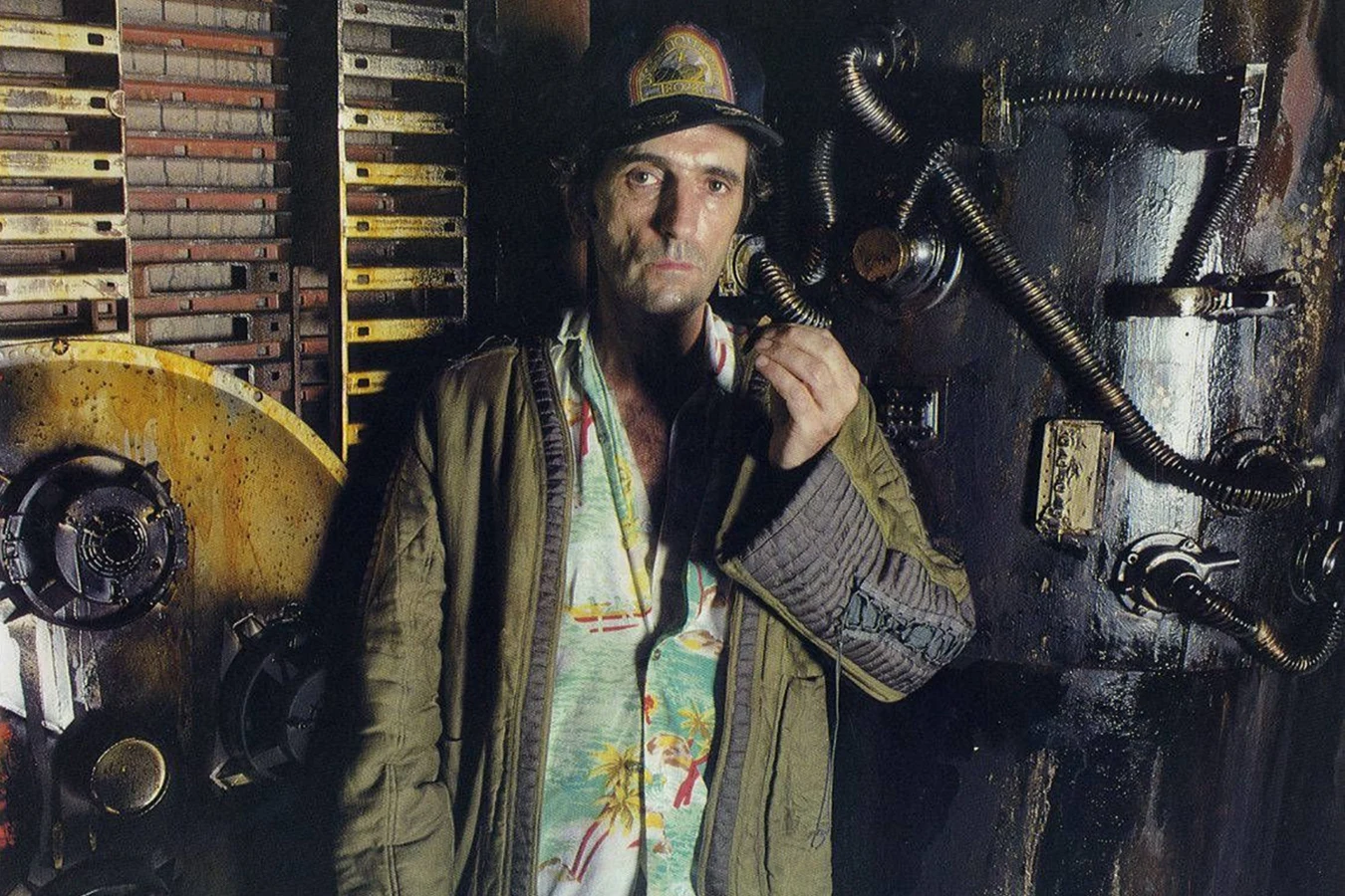 Harry Dean Stanton as Brett beside Nostromo machinery on the Alien set