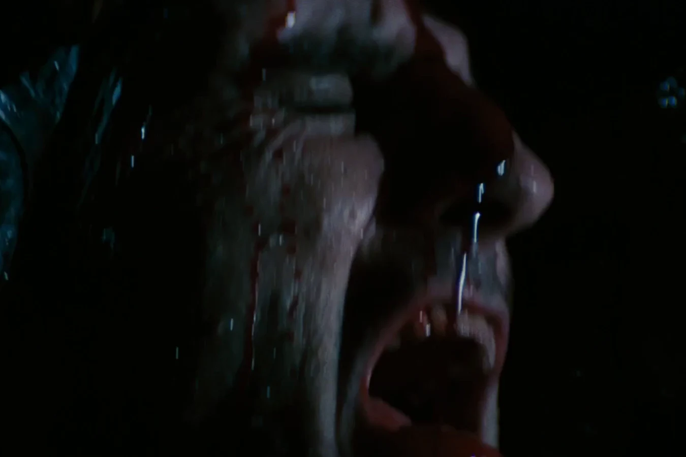 Blood on Brett's face after the adult Xenomorph headbites him and takes him up in Alien