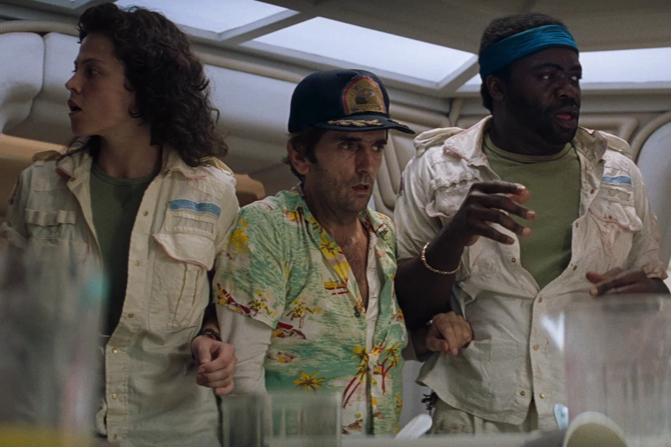 Lambert, Brett, and Parker at the Nostromo mess table as the Chestburster kills Kane in Alien