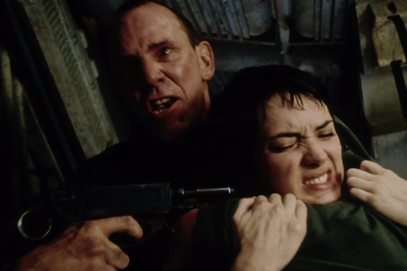 Dr. Wren holding Call at gunpoint aboard the Betty