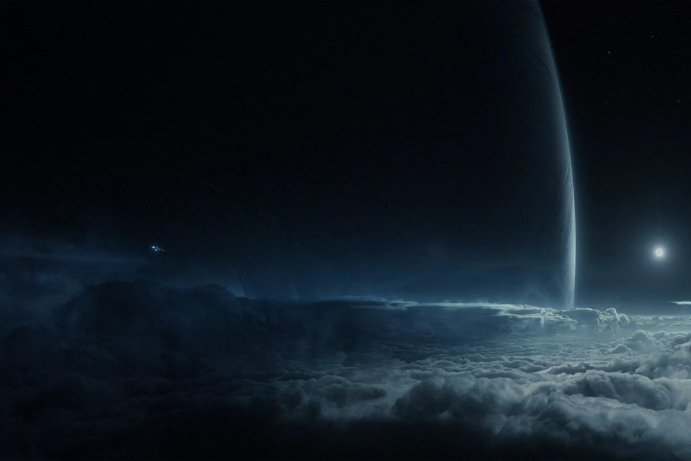 The limb of Calpamos above the cloud deck on LV-223, with the USCSS Prometheus in the sky