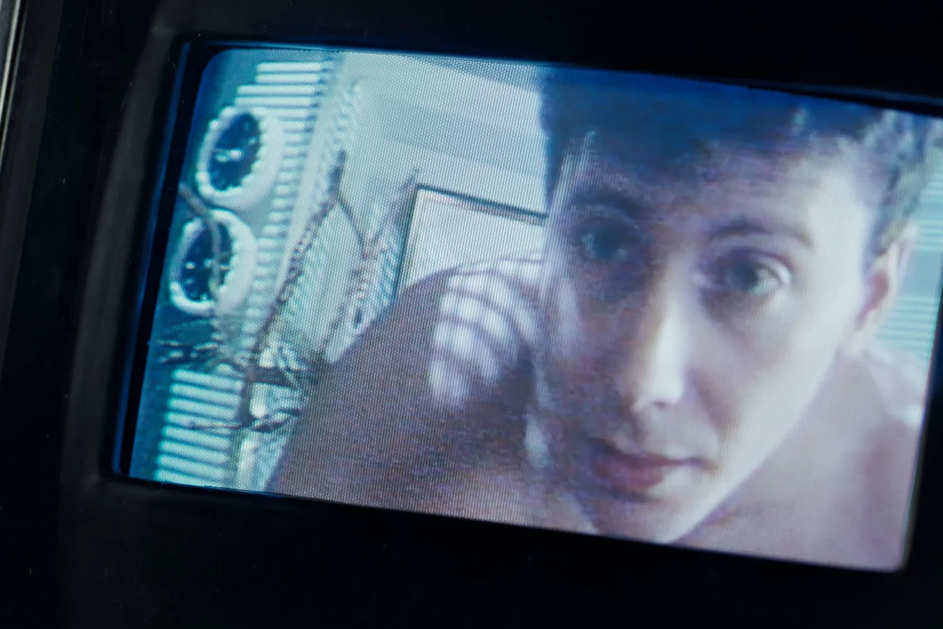 Carter Burke on a monitor in the transmission to Hadley's Hope in Aliens