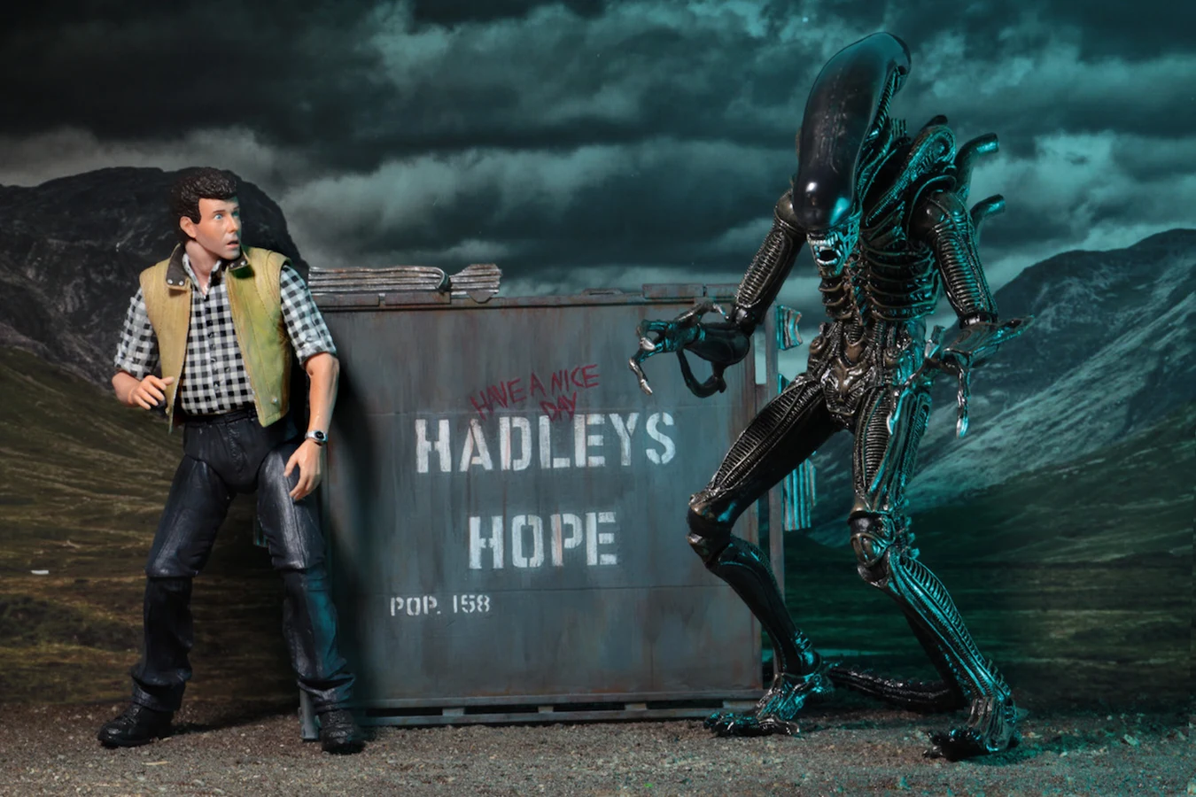 NECA Aliens Hadley's Hope set with the Carter Burke figure, a domed Warrior, and the colony sign