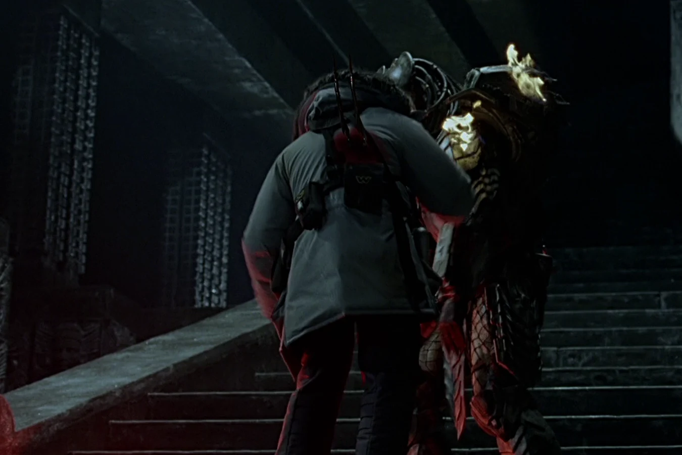 Wristblades through Charles Bishop Weyland as Scar holds him on the pyramid stairs