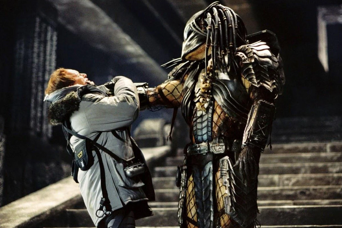 Scar holds Charles Bishop Weyland by the throat on the pyramid stairs