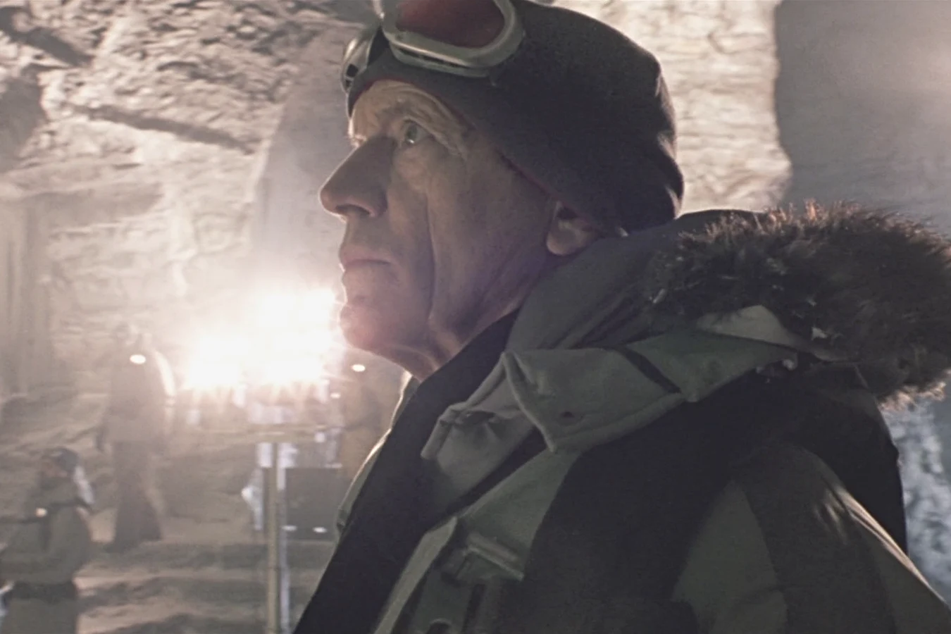 Charles Bishop Weyland in profile inside the lit pyramid under Bouvetoya