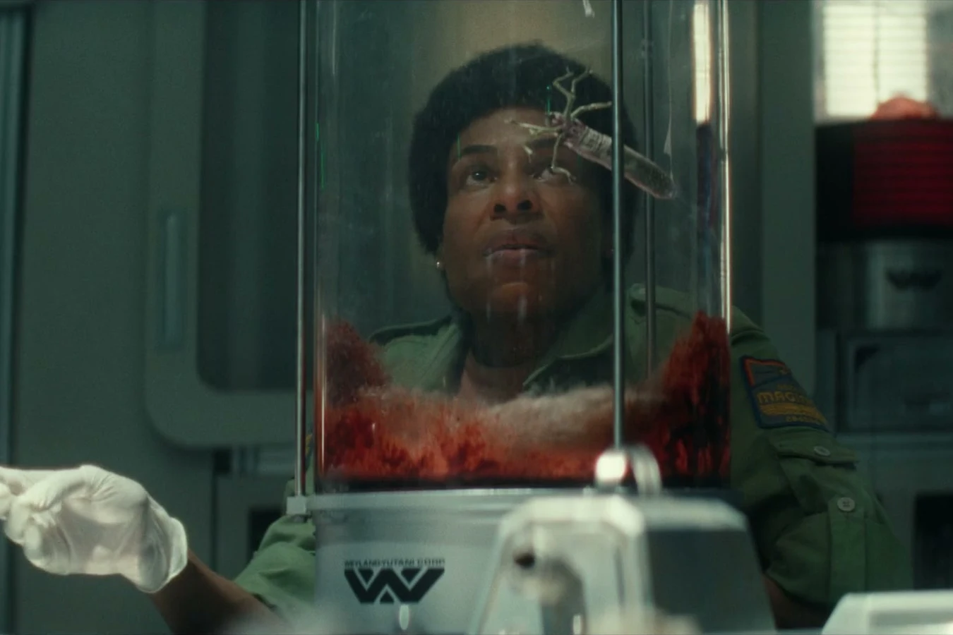 Chibuzo in Maginot lab gloves watching a Species 19 specimen jar in Alien: Earth