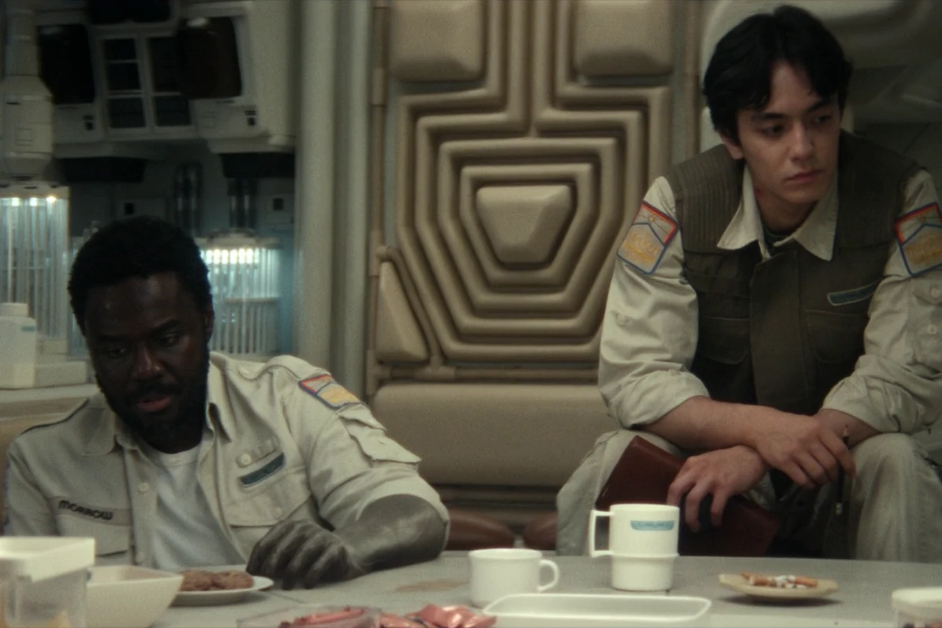 Clem Madey seated in the Maginot mess hall during the emergency briefing in Alien: Earth
