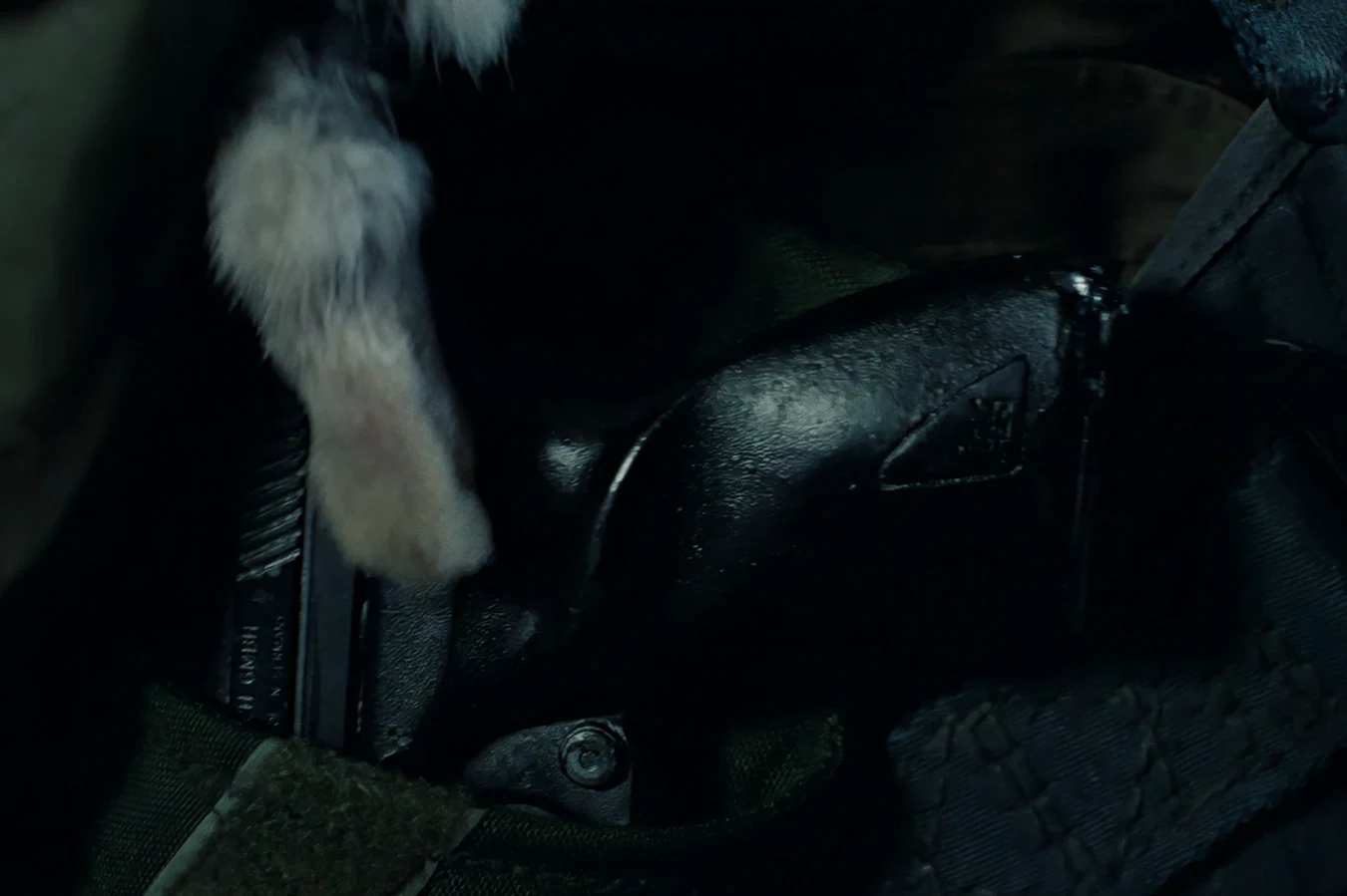 Colette Ferro's VP70 in an olive holster with a rabbit's foot on the chain in Aliens