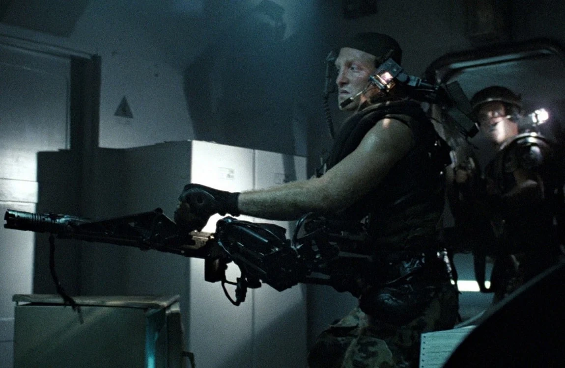 Private First Class Mark Drake firing a smartgun in Aliens