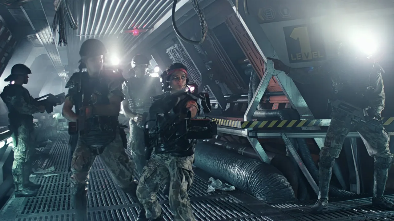 Colonial Marines armed with weapons inside Hadley's Hope colony in Aliens
