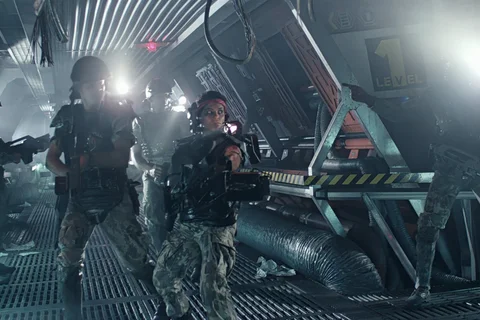 Colonial Marines armed with weapons inside Hadley's Hope colony in Aliens